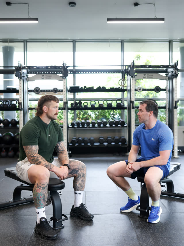 Two members catching up between sets