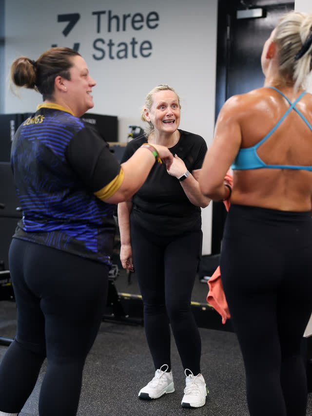 Members laughing together mid-session