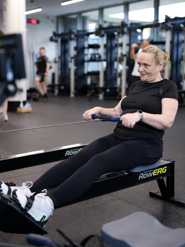 A member smiling on the rower