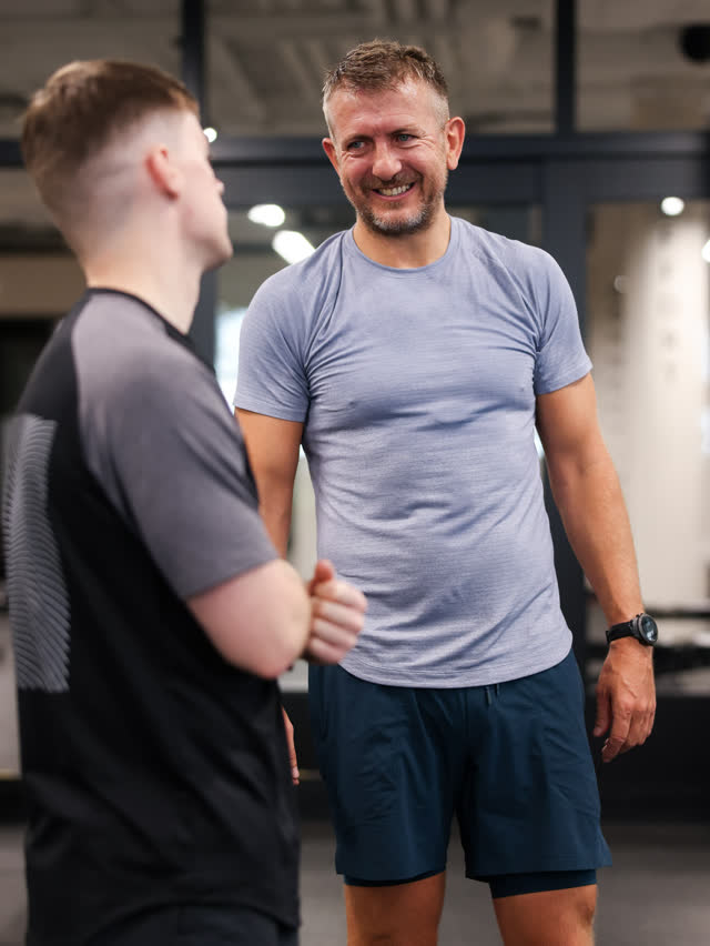 Two members chatting between sets
